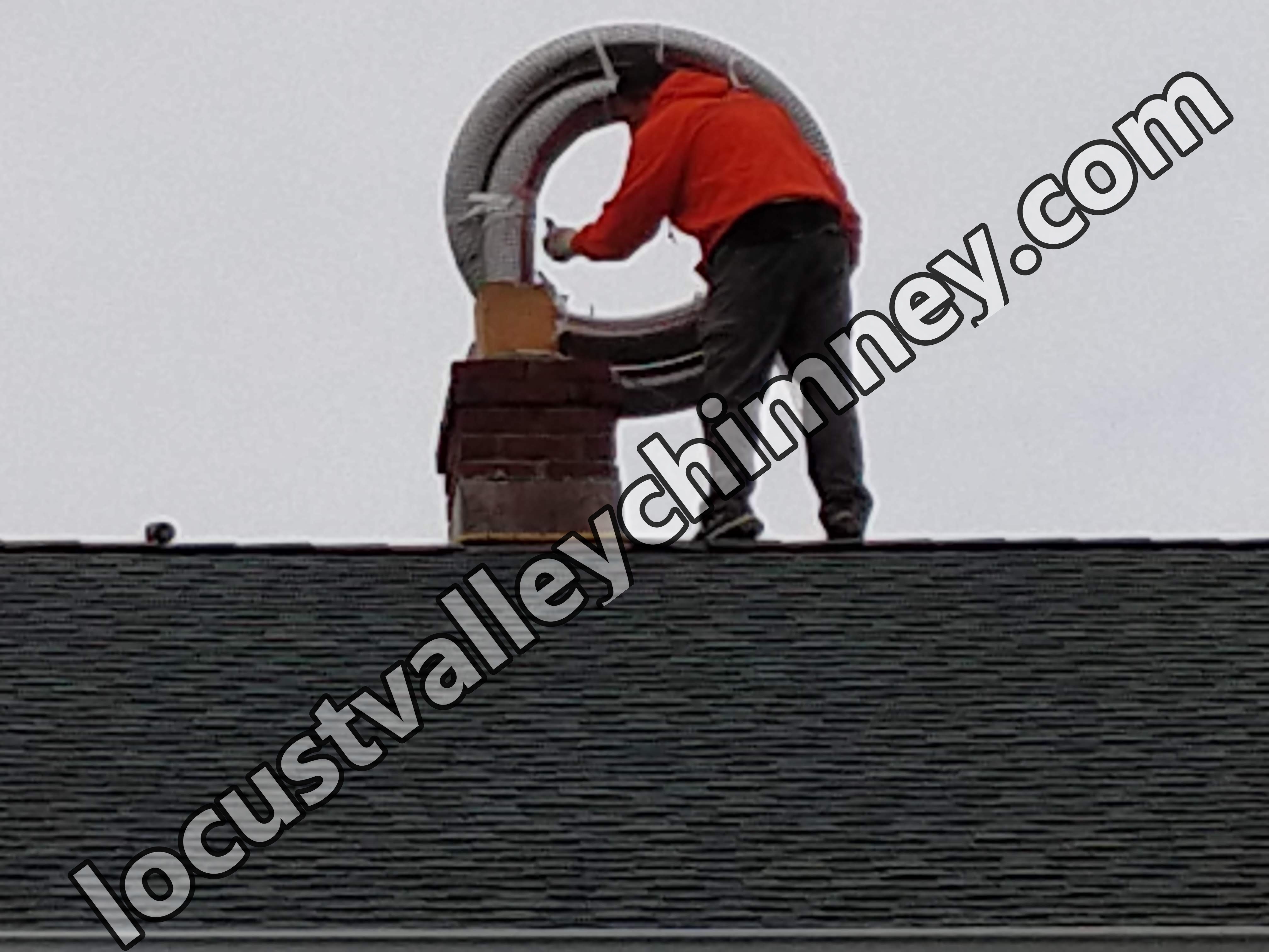 Flexible stainless chimney liner being installed in Mill Neck, New York